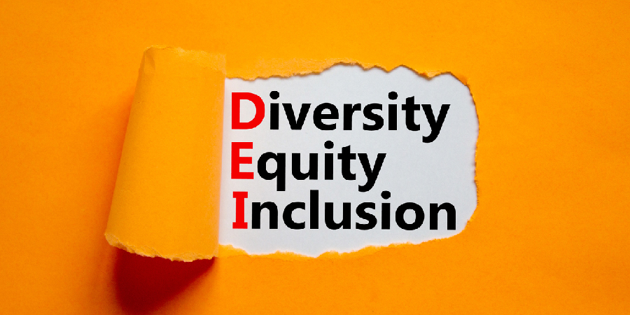 Diversity, equity, inclusion DEI symbol. Words DEI, diversity, equity, inclusion appearing behind torn orange paper. Orange background. Business, diversity, equity, inclusion concept, copy space.