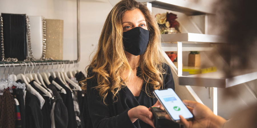 Contactless payment during Covid-19 pandemic using all safety protection Contactless payment during Covid-19 pandemic using all safety protection with mask.
