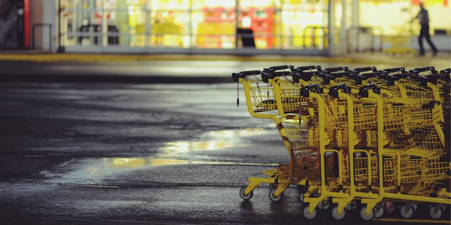 Row of shopping carts outside a grocery store